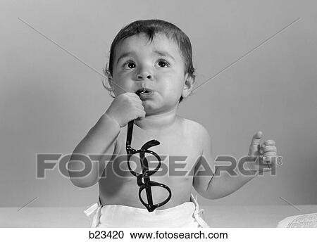 1960S Baby In Diaper Chewing On Eyeglasses View Large Photo Image Stock Image - 1960S Baby In Diaper Chewing On Eyeglasses. Fotosearch