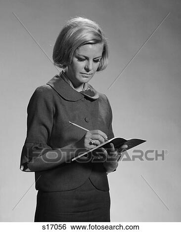 Stock Photograph - 1960S Blond Woman Secretary Teacher Taking Notes. Fotosearch