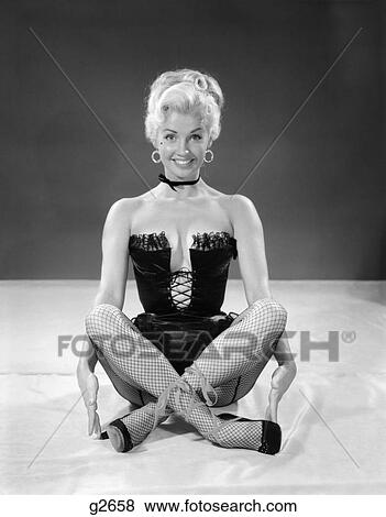 1960S Blonde Cheesecake Portrait Of Woman Wearing Black Camisole Corset