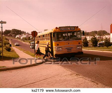 1960S Boy Girl Suburban Community Street Getting Into School Bus View Large Photo Image Stock Photo - 1960S Boy Girl Suburban Community Street Getting Into School Bus . Fotosearch