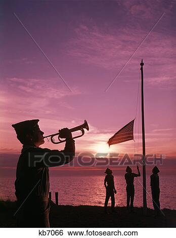 1960S Boy Scout Blowing Bugle As Others Raise American Flag At Camp Sunset Ceremony View Large Photo Image Stock Photograph - 1960S Boy Scout Blowing Bugle As Others Raise American Flag At Camp Sunset Ceremony. Fotosearch