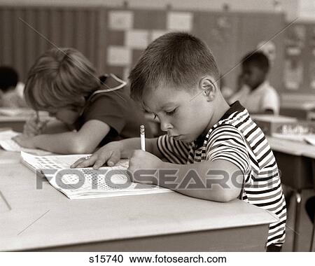1960S Boy Striped T-Shirt Elementary School Classroom Sitting Desk Writing Test View Large Photo Image Stock Image - 1960S Boy Striped T-Shirt Elementary School Classroom Sitting Desk Writing Test. Fotosearch