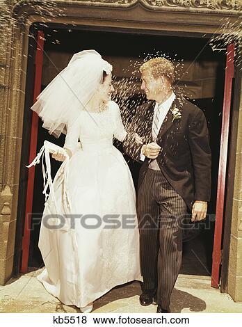 1960S Bride Groom Leave Church Throwing Rice View Large Photo Image Stock Photo - 1960S Bride Groom Leave Church Throwing Rice. Fotosearch