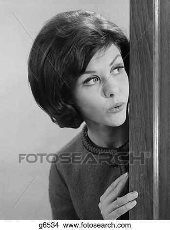 1960S Brunette Woman Peeking Around Corner View Large Photo Image Picture - 1960S Brunette Woman Peeking Around Corner. Fotosearch