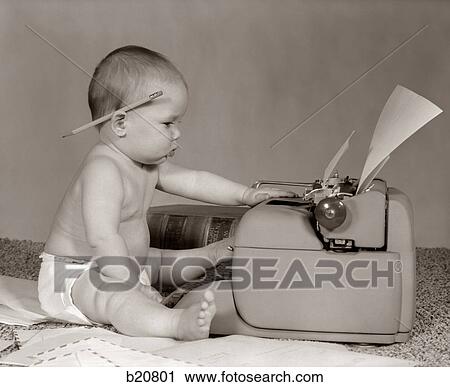 1960S Businesslike Baby With Pencil Behind Ear Typing On Typewriter View Large Photo Image Stock Image - 1960S Businesslike Baby With Pencil Behind Ear Typing On Typewriter. Fotosearch