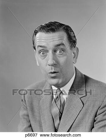 1960S Businessman Bulging Eyes Wide Open Shocked Facial Expression Looking At Camera View Large Photo Image Stock Photo - 1960S Businessman Bulging Eyes Wide Open Shocked Facial Expression Looking At Camera. Fotosearch