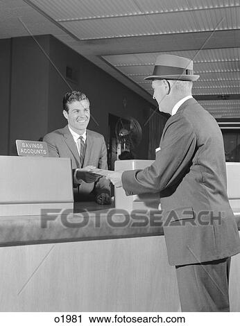 1960S Businessman Making A Deposit Into Savings Account With Bank Teller View Large Photo Image Stock Image - 1960S Businessman Making A Deposit Into Savings Account With Bank Teller . Fotosearch