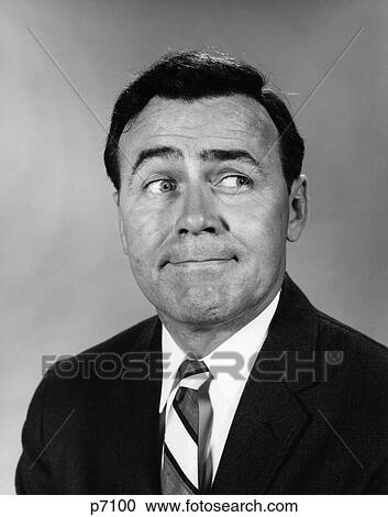 1960S Businessman Making Funny Face Looking To The Side View Large Photo Image Stock Image - 1960S Businessman Making Funny Face Looking To The Side. Fotosearch