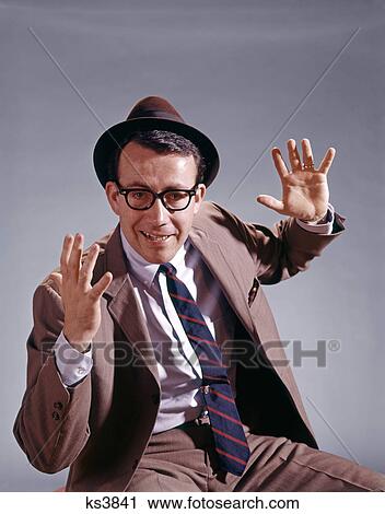 1960S Businessman Wearing Hat And Glasses Looking Startled Surprised Alarmed Or Frightened Looking At Camera View Large Photo Image Stock Image - 1960S Businessman Wearing Hat And Glasses Looking Startled Surprised Alarmed Or Frightened Looking At Camera. Fotosearch