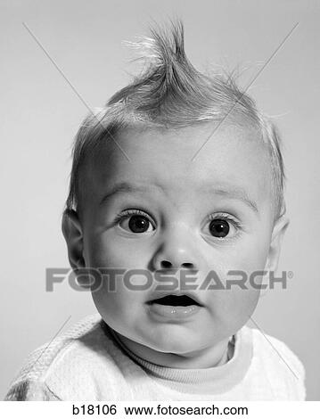 Stock Photograph - 1960S Close-Up Portrait Baby With Wide-Eyed Expression With Mouth Open. Fotosearch
