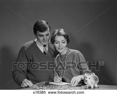 1960S Couple Counting Coins From Piggy Bank View Large Photo Image Stock Photography - 1960S Couple Counting Coins From Piggy Bank. Fotosearch