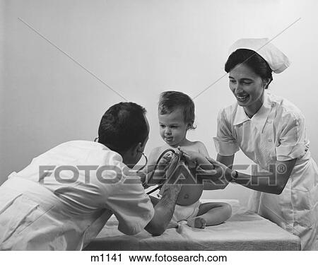 Stock Image - 1960S Doctor Nurse Examining Baby Chest With Stethoscope. Fotosearch