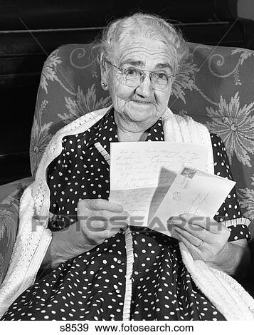 1960S Elderly Woman In Polka-Dotted Dress & Shawl Reading Letter View Large Photo Image Stock Photo - 1960S Elderly Woman In Polka-Dotted Dress & Shawl Reading Letter. Fotosearch