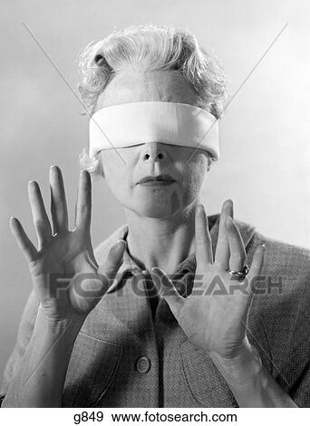 1960S Elderly Woman Wearing Blindfold Holding Up Her Hands View Large Photo Image Stock Photo - 1960S Elderly Woman Wearing Blindfold Holding Up Her Hands. Fotosearch