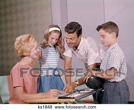 1960S Family Mother Father Daughter Son Together Bowling Looking At Score View Large Photo Image Stock Photo - 1960S Family Mother Father Daughter Son Together Bowling Looking At Score . Fotosearch