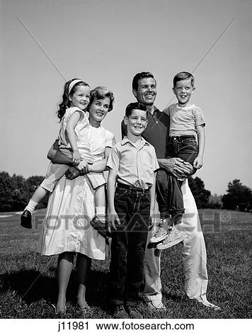 1960S Family Portrait Father Mother Daughter Son Standing Together Outdoors View Large Photo Image Stock Image - 1960S Family Portrait Father Mother Daughter Son Standing Together Outdoors. Fotosearch