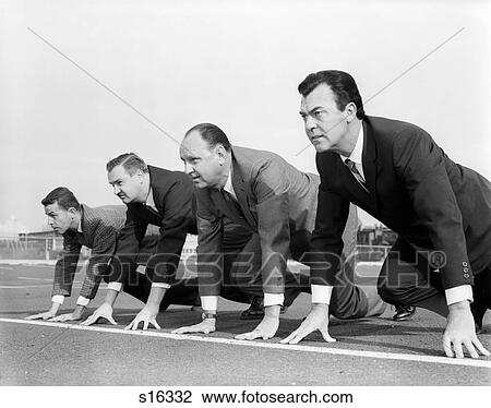 Stock Image - 1960S Four Businessmen On The Starting Line. Fotosearch