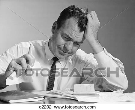 1960S Frustrated Businessman Hand To Forehead Crumpling Paper In Hand View Large Photo Image Stock Image - 1960S Frustrated Businessman Hand To Forehead Crumpling Paper In Hand. Fotosearch
