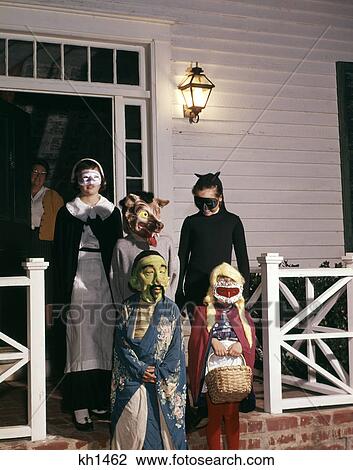 1960S Group Of Children In Halloween Costumes On Porch Trick Or Treating View Large Photo Image Stock Image - 1960S Group Of Children In Halloween Costumes On Porch Trick Or Treating. Fotosearch