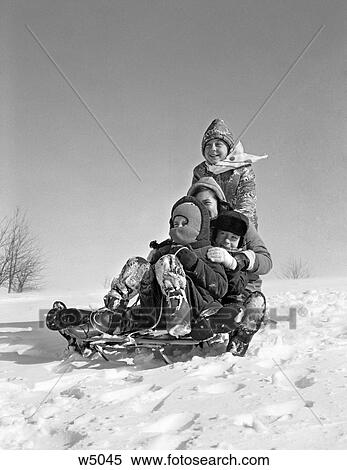 1960S Group Of Four Kids Piled Up On Sled View Large Photo Image Stock Photography - 1960S Group Of Four Kids Piled Up On Sled. Fotosearch