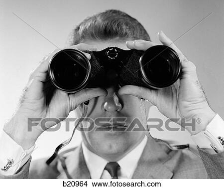 Picture - 1960S Head-On Close-Up Of Man Looking Through Binoculars. Fotosearch