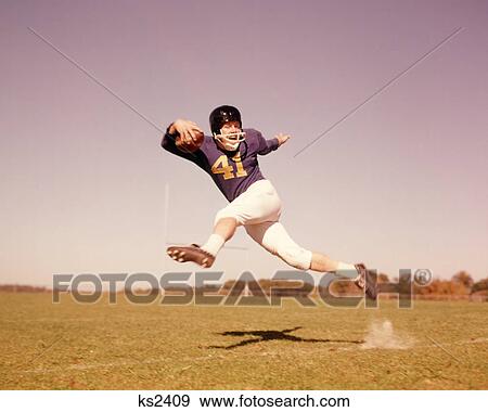 1960S Jumping Running Man Football Player View Large Photo Image Stock Photo - 1960S Jumping Running Man Football Player. Fotosearch