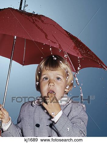 1960S Little Blond Girl Standing Under Red Umbrella Looking Sad View Large Photo Image Stock Photo - 1960S Little Blond Girl Standing Under Red Umbrella Looking Sad . Fotosearch