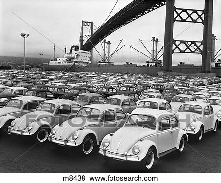 Stock Photo - 1960S Loading Dock With Parked Volkswagen Beetles . Fotosearch
