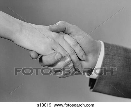 Stock Photo - 1960S Male And Female Handshake. Fotosearch