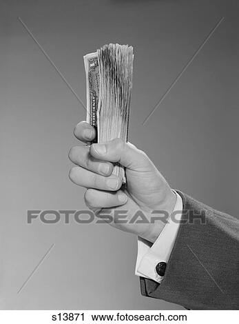 1960S Male Hand Holding A Fistful Dollars Cash Money View Large Photo Image Stock Image - 1960S Male Hand Holding A Fistful Dollars Cash Money. Fotosearch