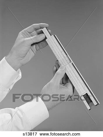 1960S Male Hands Holding A Slide Rule Measure View Large Photo Image Stock Photo - 1960S Male Hands Holding A Slide Rule Measure. Fotosearch