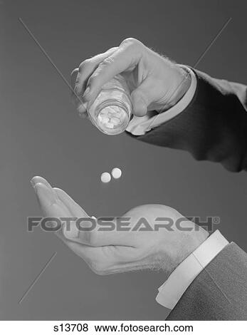 1960S Male Hands Shaking Two Aspirins Pills From Bottle View Large Photo Image Stock Photo - 1960S Male Hands Shaking Two Aspirins Pills From Bottle. Fotosearch