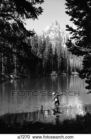 1960S Man Fishing Holding Net And Rod Wyoming Grand Teton National Park String Lake View Large Photo Image Stock Image - 1960S Man Fishing Holding Net And Rod Wyoming Grand Teton National Park String Lake. Fotosearch