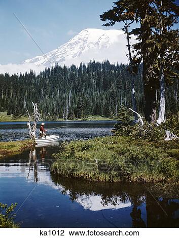 1960S Man Fishing Standing In Row Boat Reflection Lake Mount Rainier Washington View Large Photo Image Stock Image - 1960S Man Fishing Standing In Row Boat Reflection Lake Mount Rainier Washington. Fotosearch