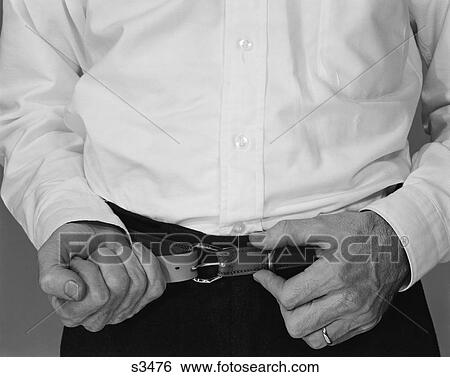 1960S Man Hands Tightening Belt View Large Photo Image Stock Photograph - 1960S Man Hands Tightening Belt. Fotosearch