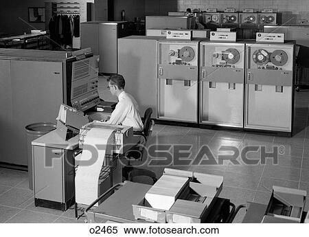 1960S Man Programming Large Mainframe Computer Surrounded By Data Tape Drives Indoor View Large Photo Image Stock Photography - 1960S Man Programming Large Mainframe Computer Surrounded By Data Tape Drives Indoor. Fotosearch
