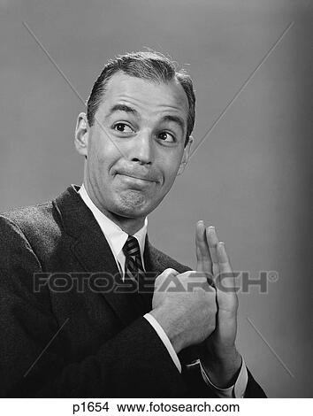 Picture - 1960S Man Punching His Fist Into His Palm With Satisfied Expression. Fotosearch
