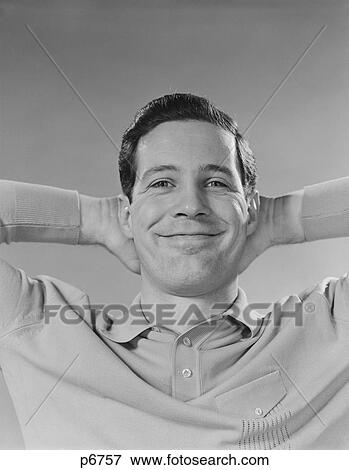 1960S Man Smiling Relaxing With Hands Behind Head Looking At Camera View Large Photo Image Stock Photo - 1960S Man Smiling Relaxing With Hands Behind Head Looking At Camera. Fotosearch