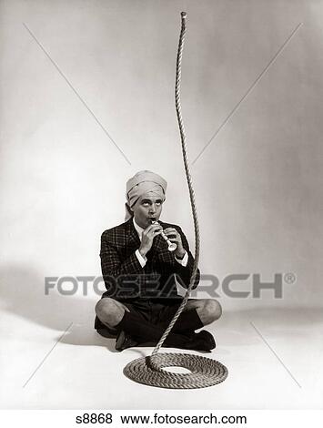 1960S Man Snake Charmer Character In Turban Plaid Jacket Shorts Knee Socks View Large Photo Image Stock Photo - 1960S Man Snake Charmer Character In Turban Plaid Jacket Shorts Knee Socks. Fotosearch
