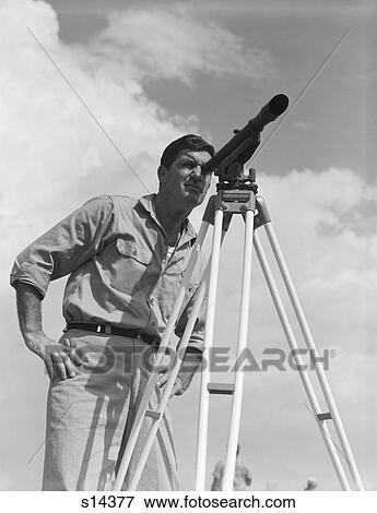 1960S Man Using A Theodolite While Surveying View Large Photo Image Stock Photo - 1960S Man Using A Theodolite While Surveying. Fotosearch