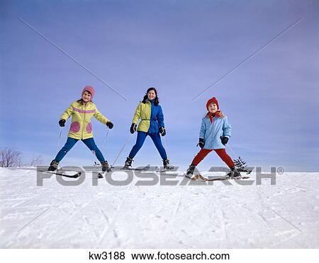1960S Mother And Two Daughters Skiing Together Winter Outdoor Looking At Camera View Large Photo Image Stock Photo - 1960S Mother And Two Daughters Skiing Together Winter Outdoor Looking At Camera. Fotosearch