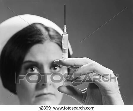 1960S Nurse Adjusting Dosage Injection Hypodermic Needle View Large Photo Image Stock Photo - 1960S Nurse Adjusting Dosage Injection Hypodermic Needle. Fotosearch