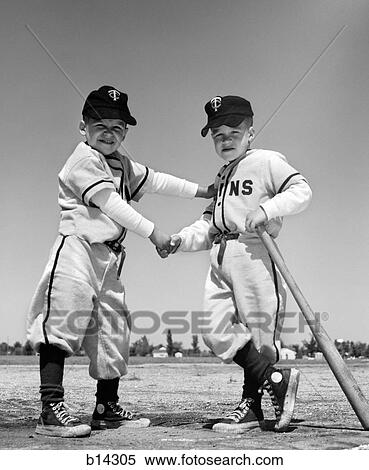 1960S Pair Of Little Leaguers In Uniform Shaking Hands One Holding Bat Looking At Camera View Large Photo Image Stock Photography - 1960S Pair Of Little Leaguers In Uniform Shaking Hands One Holding Bat Looking At Camera. Fotosearch