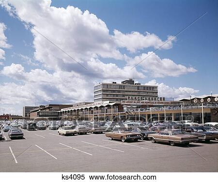 1960S Place Laurcer Quebec Canada Cars In Parking Lot Of Shopping Center Retail Business View Large Photo Image Stock Photography - 1960S Place Laurcer Quebec Canada Cars In Parking Lot Of Shopping Center Retail Business . Fotosearch