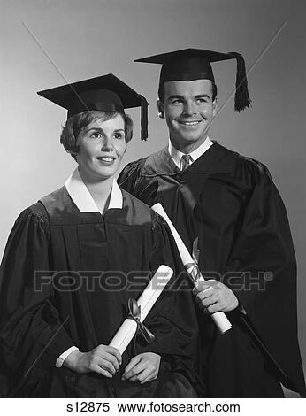 1960S Portrait Couple Man Woman In Graduation Robes Holding Diplomas Smiling View Large Photo Image Stock Photography - 1960S Portrait Couple Man Woman In Graduation Robes Holding Diplomas Smiling. Fotosearch