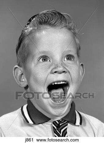 Stock Image - 1960S Portrait Excited Boy With Mouth Wide Open Laughing. Fotosearch