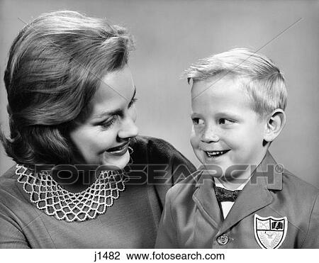 1960S Portrait Mother With Arm Around Son Dressed In School Uniform With Bow Tie & Emblem Crest On Jacket Mom Pearl Lace Collar View Large Photo Image Stock Image - 1960S Portrait Mother With Arm Around Son Dressed In School Uniform With Bow Tie & Emblem Crest On Jacket Mom Pearl Lace Collar. Fotosearch