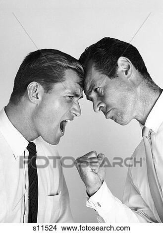 1960S Portrait Of 2 Businessmen Head To Head Fighting Fists Raised View Large Photo Image Picture - 1960S Portrait Of 2 Businessmen Head To Head Fighting Fists Raised. Fotosearch
