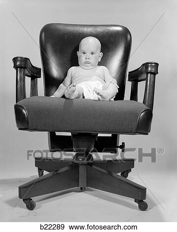 1960S Portrait Of Chubby Bald Baby In Diaper Sitting In Executive Office Chair View Large Photo Image Stock Photo - 1960S Portrait Of Chubby Bald Baby In Diaper Sitting In Executive Office Chair. Fotosearch