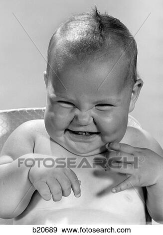1960S Portrait Of Smiling Baby Indoor Making A Funny Face View Large Photo Image Stock Photo - 1960S Portrait Of Smiling Baby Indoor Making A Funny Face. Fotosearch